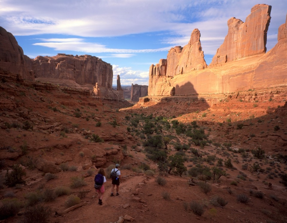 Hikers explore Arches National Park