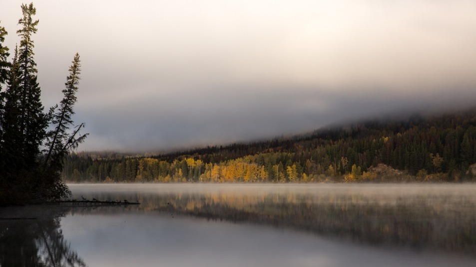 Rocky Mountaineer by a lake 