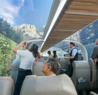 Guests looking through glass-dome coaches.