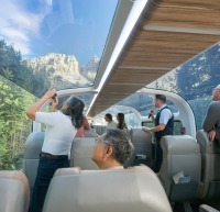 Guests looking through glass-dome coaches.
