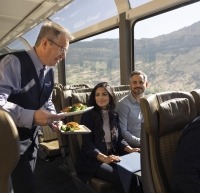 Host serving guests food on the Rockies to Red Rocks route.