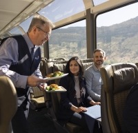 Host serving guests food on the Rockies to Red Rocks route.